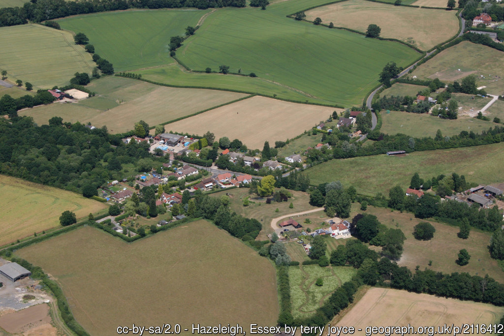 Aerial view of Hazeleigh, a small village surrounded by fields.
