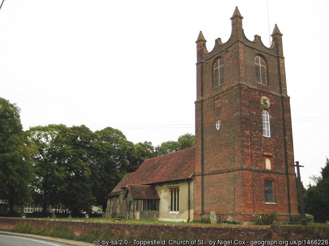 The church at Toppesfield, with its large brick tower and older nave.